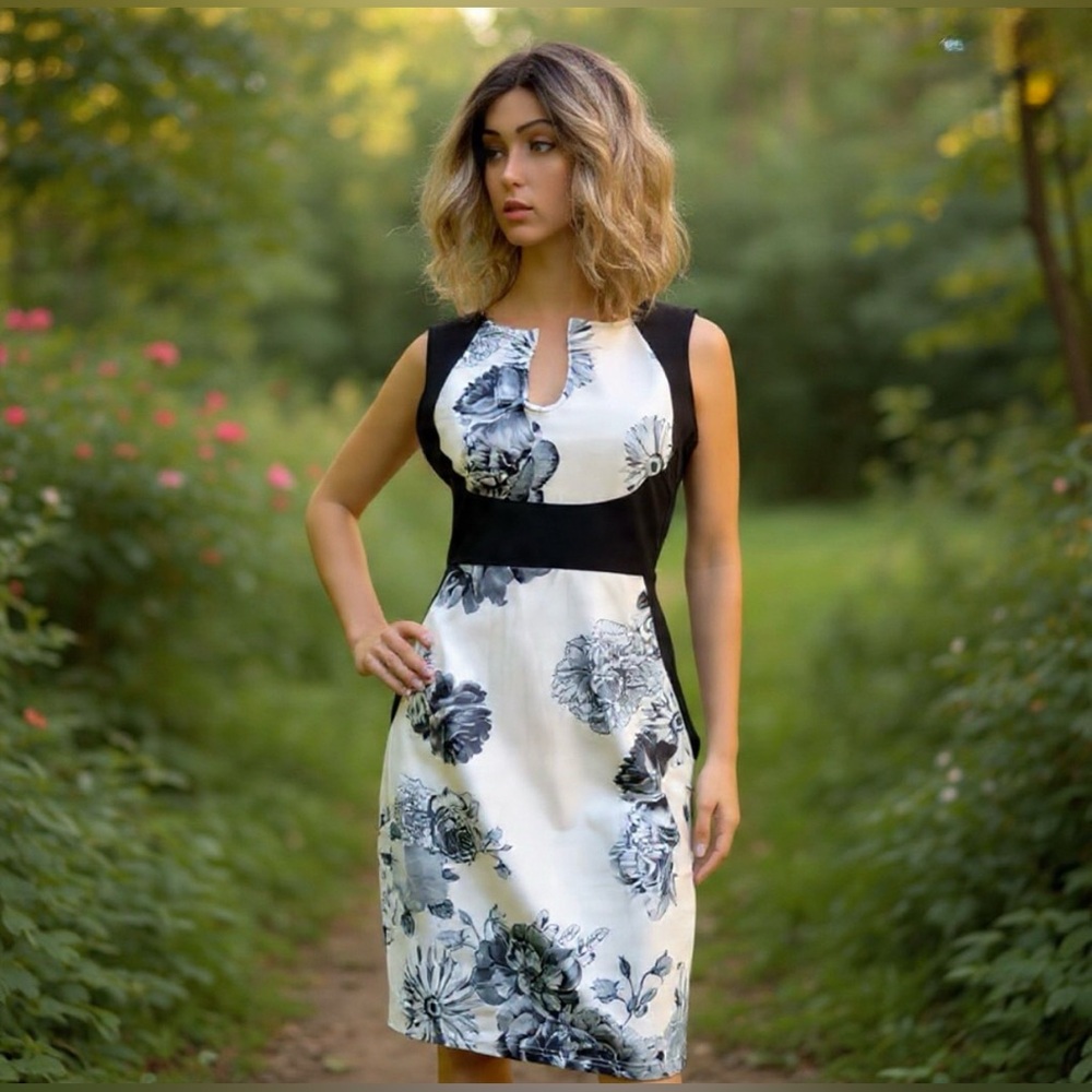 NWT Fantaist black and white bodycon dress. Side zipper above the knees. Size L